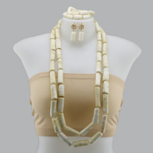 Which Look Gets Your Vote, White Ivory Beads or the Coral Beads?